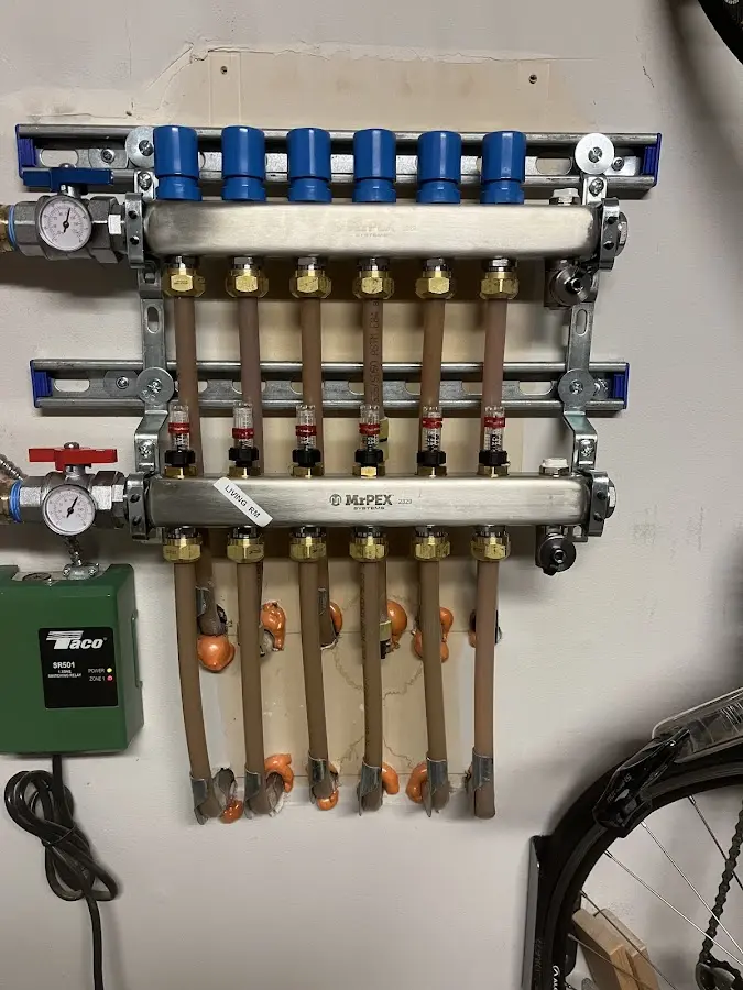 Plumber performing Water Heater Repair at a residential property in Killingly